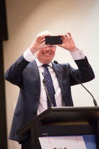 Gareth Ward takes a picture of the protest meeting to send to Premier Mike Baird